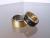 Uitschuifbare trouwringen in titanium met geelgoud en zirkonium met geelgoud met diamant