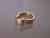 Rosgouden spanring met synthetisch witte saffier